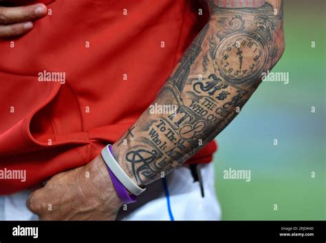 The Left Arm Of Miami Marlins Manager Skip Schumaker Is Decorated With Tattoos As He Stands The Left Arm Of Miami Marlins Manager Skip Schumaker Is Decorated With Tattoos As He Stands
